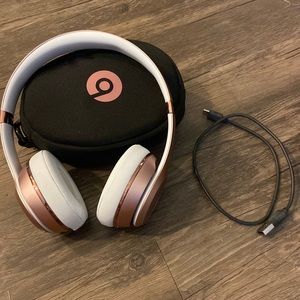 Beats, rose gold head phones